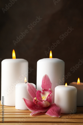 Candles and orchid on bamboo table. Zen concept