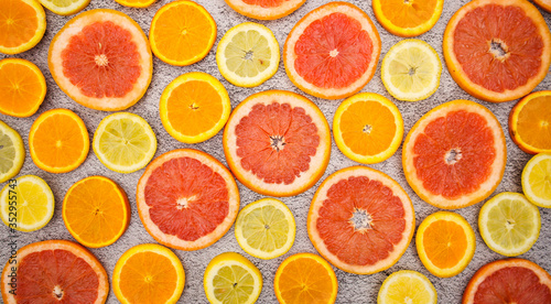 Slices of citrus fruits on the table 