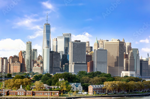 New York City panorama from the bay with Governors island and Manhattan Skyline 