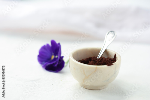 On a white background in a cup of cocoa with a spoon.
