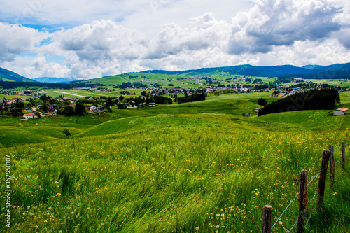 Bild auf Leinwand grasslands, clouds and mountains three