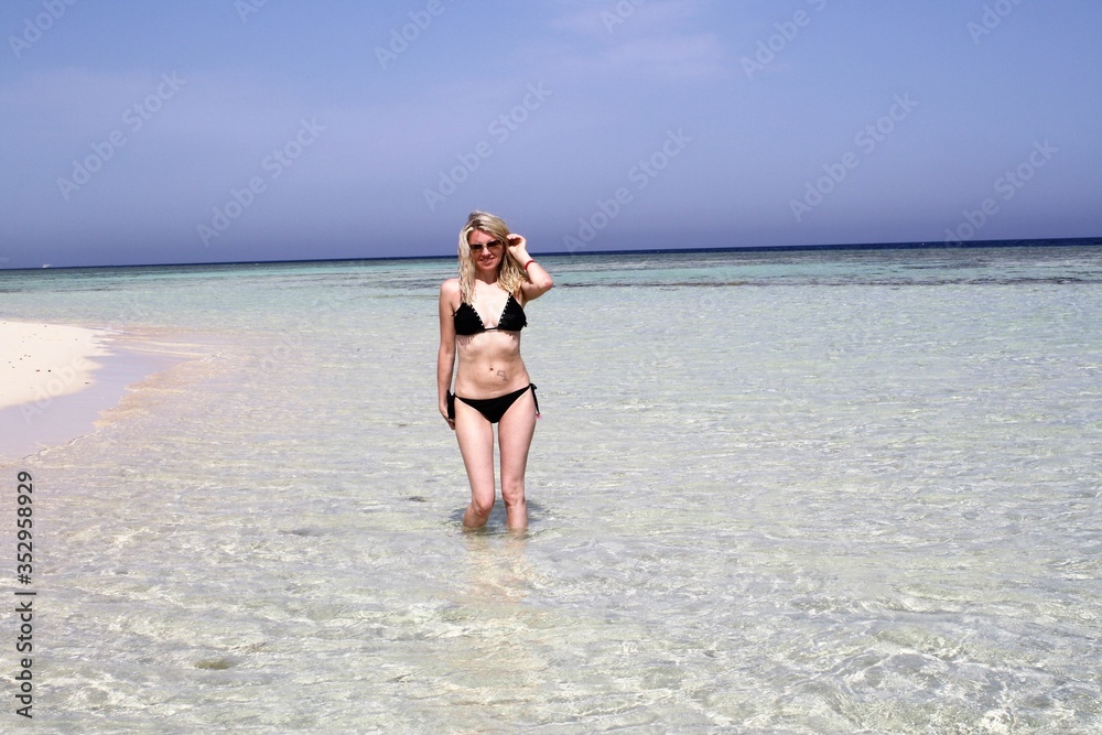 Fototapeta premium woman in bikini on the beach