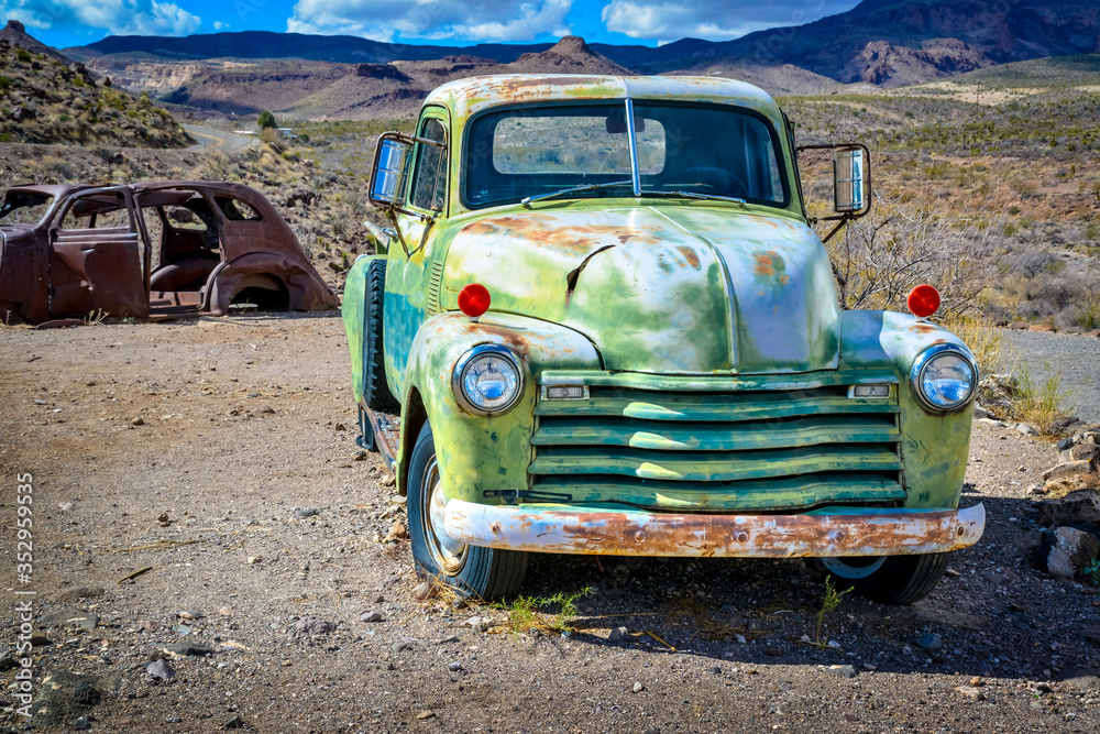Old rusty and abandoned car in the Arizona desert USA Old rusty and abandoned car in the Arizona desert USA