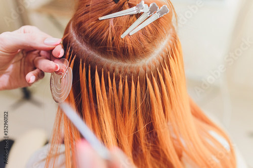 Fotografie Hair salon, beauty spa. Procedure of hair extensions.