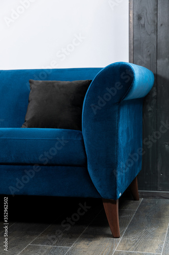 Obraz na płótnie Blue Sofa in the room with white walls. w salonie