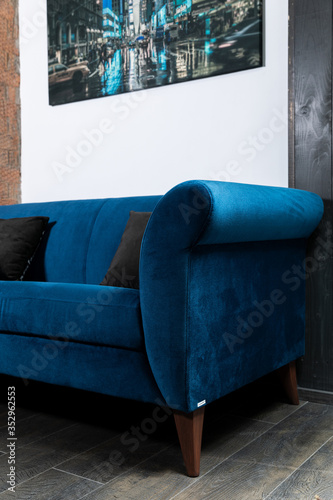 Obraz na płótnie Blue Sofa in the room with white walls. w salonie