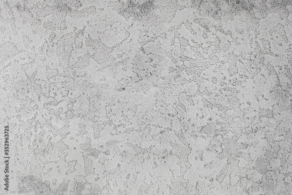 Light gray textured isolated background photographed with studio light.