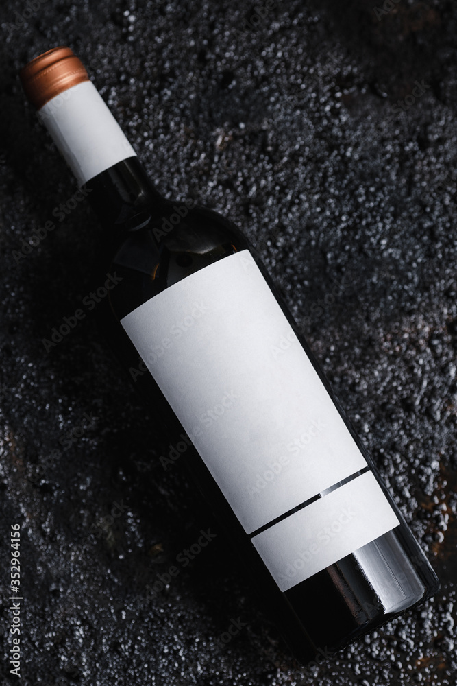 Photo of a bottle of wine on black isolated background.