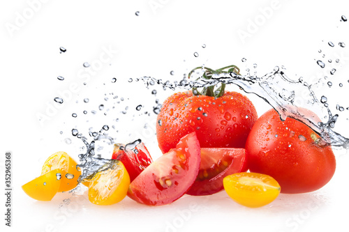 tomatoes on white background and water splash and drops