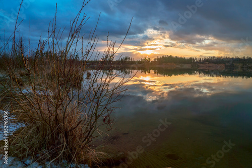 Spring sunset over the lake in calm weather . Vsevolozhsk. Leningrad region .