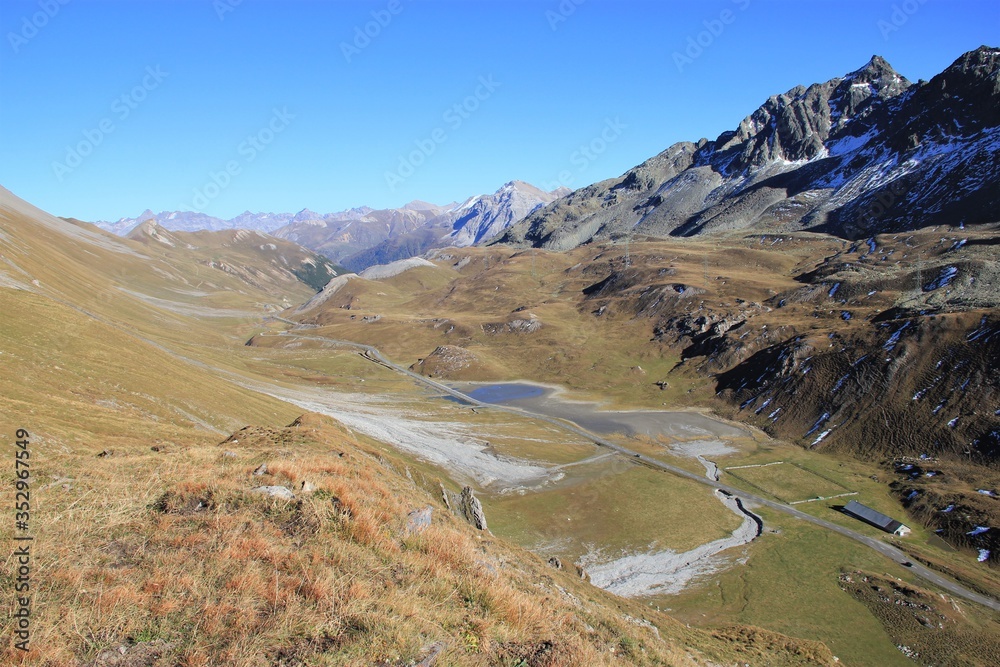 View Eastwards Down the Deserted Albula Pass Road on a Crisp Autumn Afternoon With a Light Blue Sky and Majestic Swiss Mountains in the Background