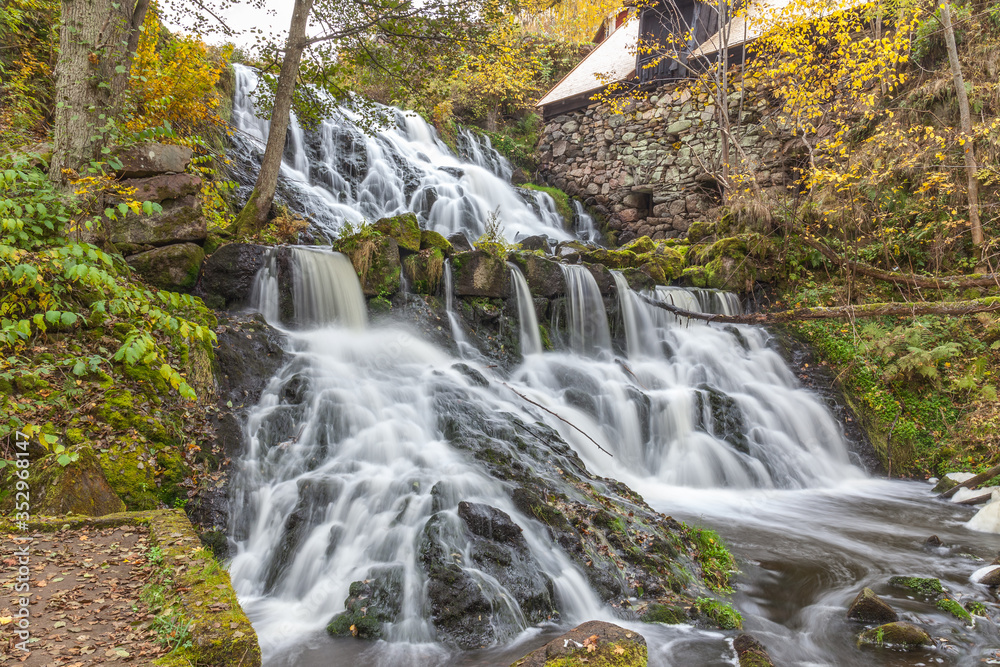 A waterfall in a forest in central Sweden photographed with a long exposure. A waterfall in a forest in central Sweden photographed with a long exposure.