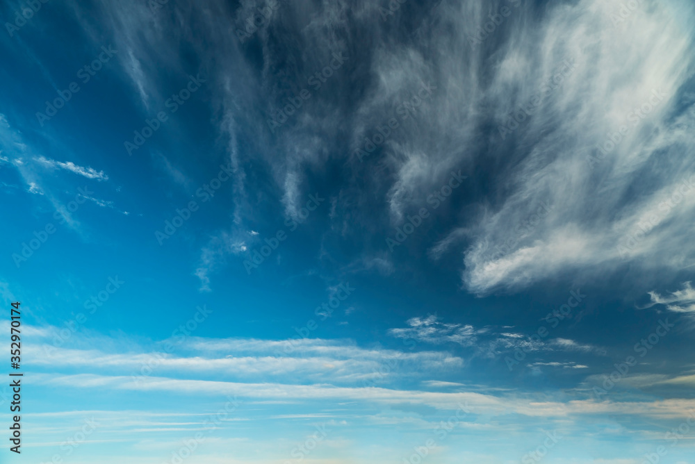 Feather clouds in the blue sky during the day. Feather clouds in the blue sky during the day.