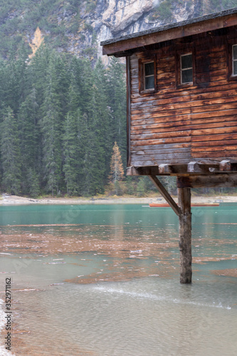 Wooden house on the Braies lake, Italy