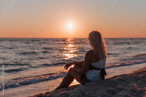 woman on the beach at sunset © Андрей Лисовский