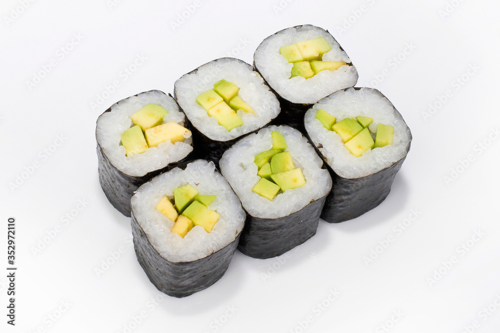 Japanese roll of nori, rice and avocado legs on a white background Japanese roll of nori, rice and avocado legs on a white background