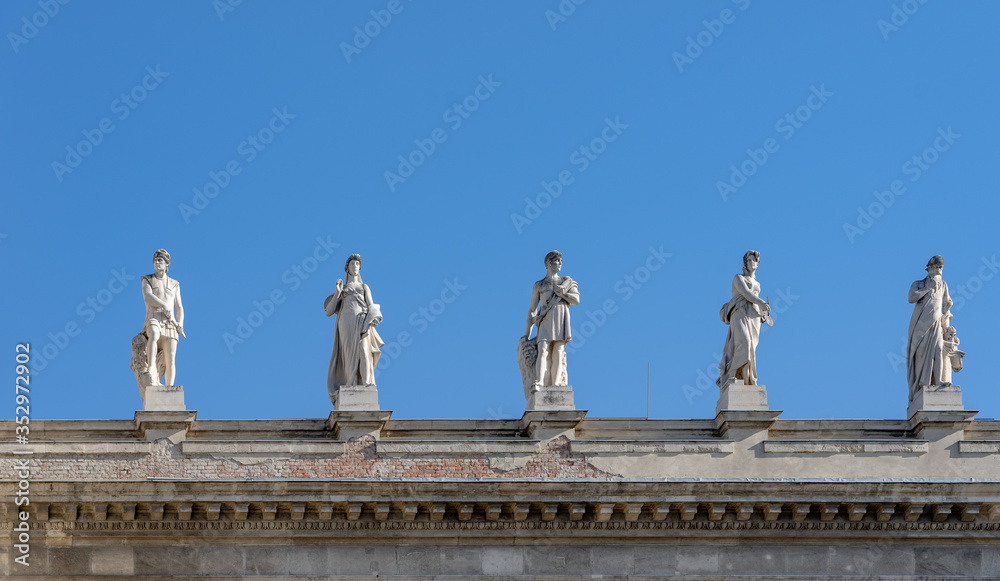 Allegorical sculptures of Attica on top right side of Museum of Ethnography in Budapest