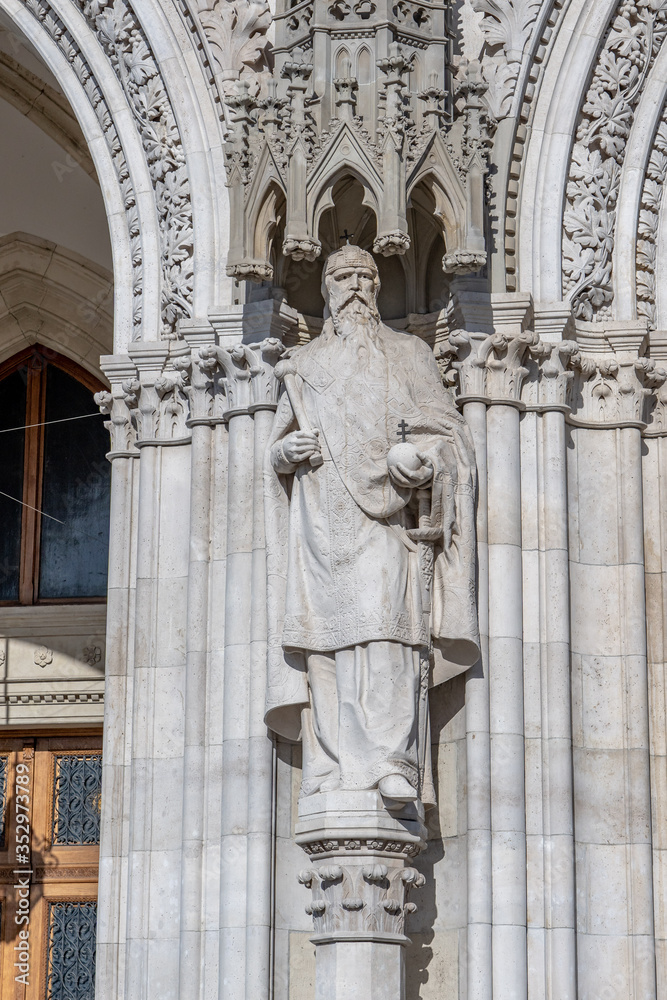 Limestone statue outside soutside entrance of Hungarian Parliament in Budapest