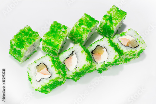 Japanese roll of tobik, rice, smoked breast, pineapple, cream cheese on a white background photo