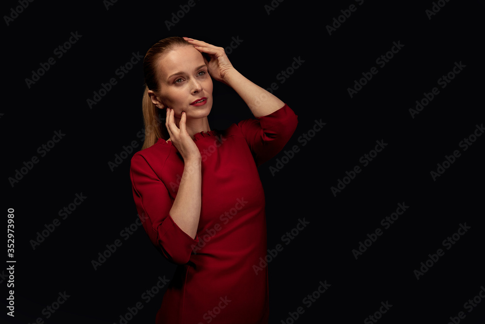 Beautiful young blonde woman in red dress. Beautiful young blonde woman in red dress.