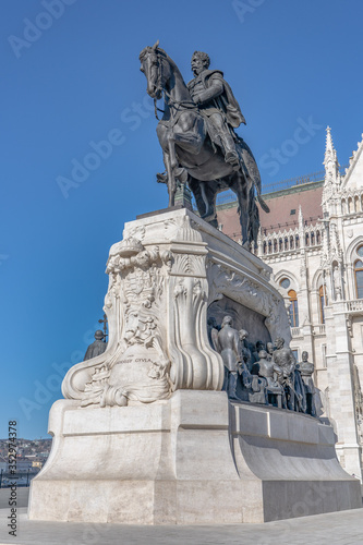 Bronze equestrian statue of Count Gyula Andrassy on lime stone in front of Hungarian Parliament in Budapest