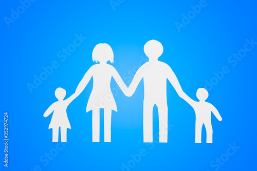 family, dad, mom, son and daughter cut out of paper on a blue background