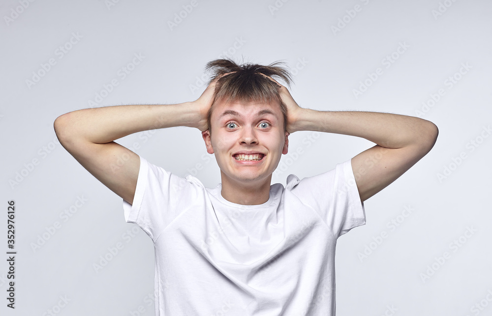 The young guy shows various emotions. Talented portrays the inner state and mood. Advertisement concept