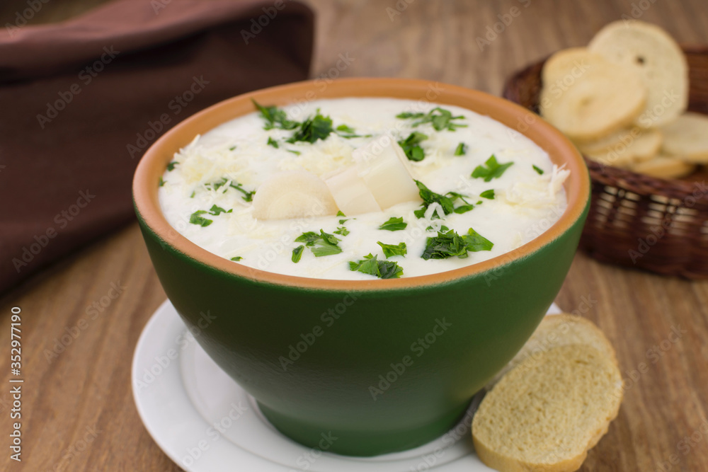 Palm heart soup in wood background Palm heart soup in wood background
