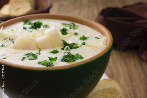 Palm heart soup close in wood background