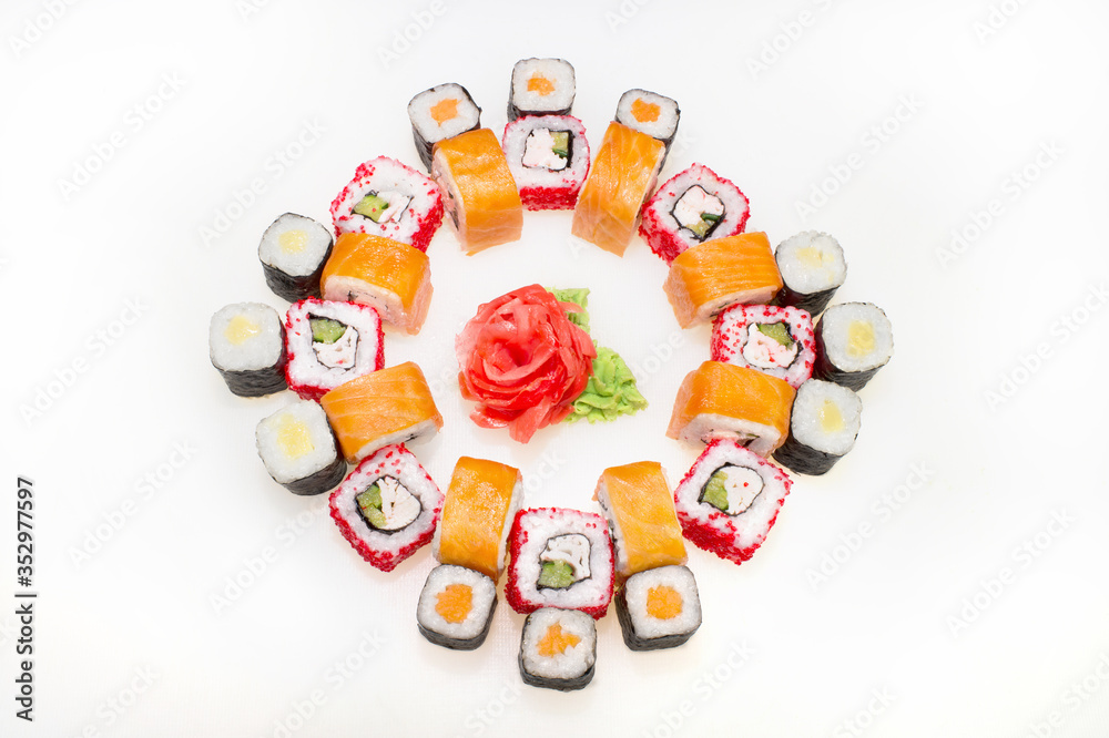 Big Japanese roll and sushi set with salmon and takuan on a white background