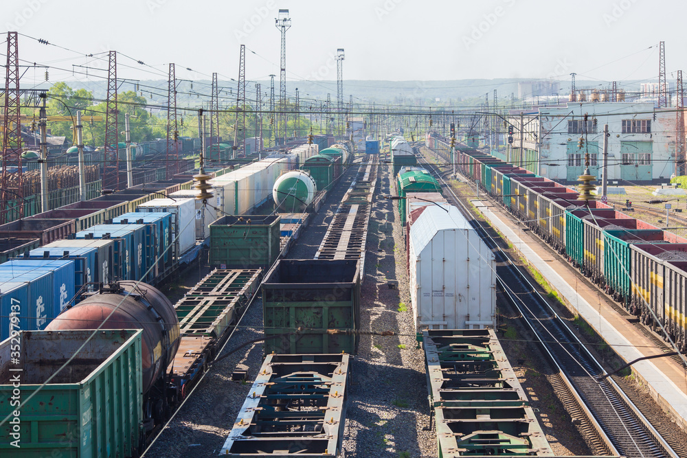 Fototapeta premium Cargo junction of the railway track. Freight wagons are on the railway.
