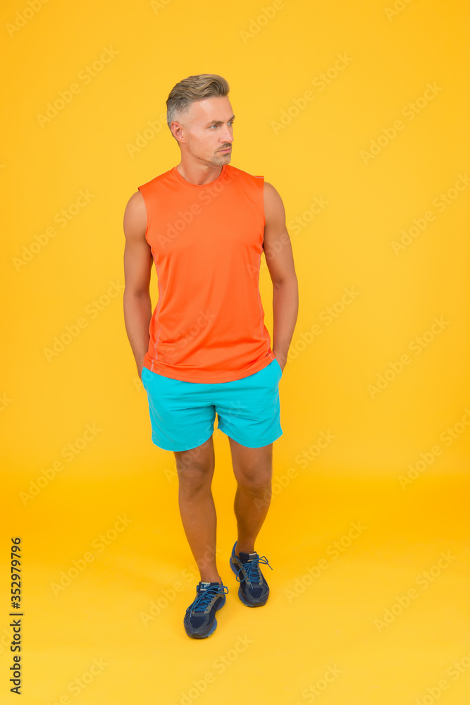 I will not be stopped. Sportsman yellow background. Strong sportsman in gym clothes. Sportsman physically fit. Active sportsman. Health and healthy lifestyle. Sport and fitness. Training and workout I will not be stopped. Sportsman yellow background. Strong sportsman in gym clothes. Sportsman physically fit. Active sportsman. Health and healthy lifestyle. Sport and fitness. Training and workout