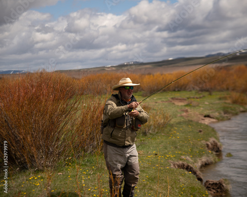 A man fly fishing on a wild western river.