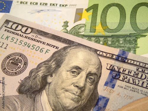 Wallpaper Mural one hundred dollar bill and one hundred euro bill finance exchange concept photo  Torontodigital.ca