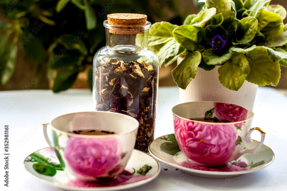 Cup of tea. Large tea leaves in a Cup. A can of tea. Large-leaf tea with fruit. Cup of tea. Large tea leaves in a Cup. A can of tea. Large-leaf tea with fruit.