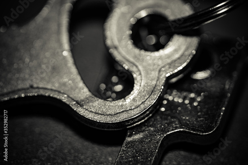 Fotografi abstract old key on the table, selective focus, macro, black and white