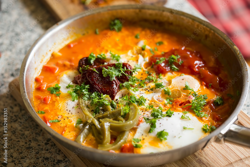 Shakshouka with red peppers & tomato paste, eggs, ras-el-hanout, chipotle peppers and pickled nopales, salsa