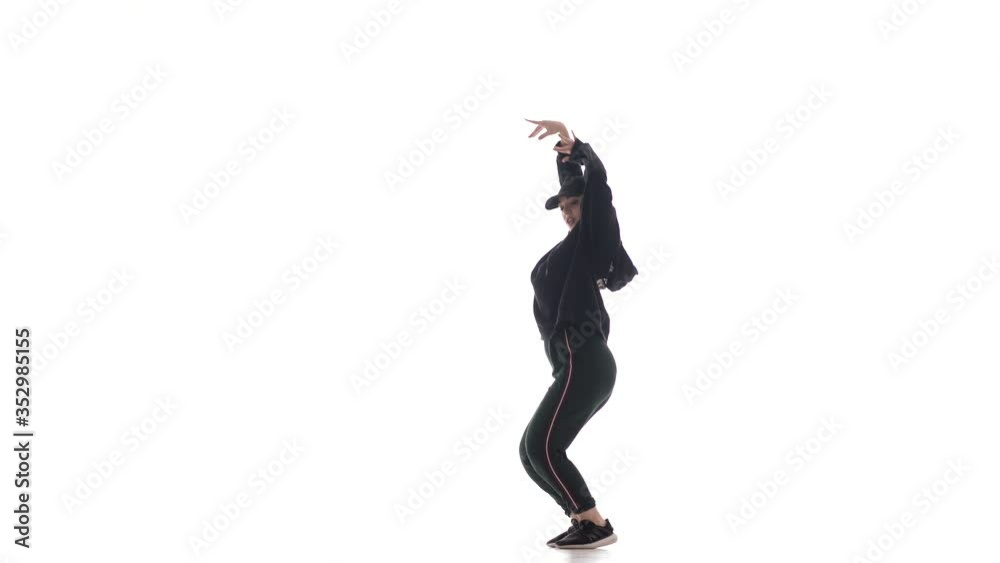young beautiful woman dancer in black leggings and a black t-shirt dancing hip hop, contemporary, modern street dance, isolated young beautiful woman dancer in black leggings and a black t-shirt dancing hip hop, contemporary, modern street dance, isolated