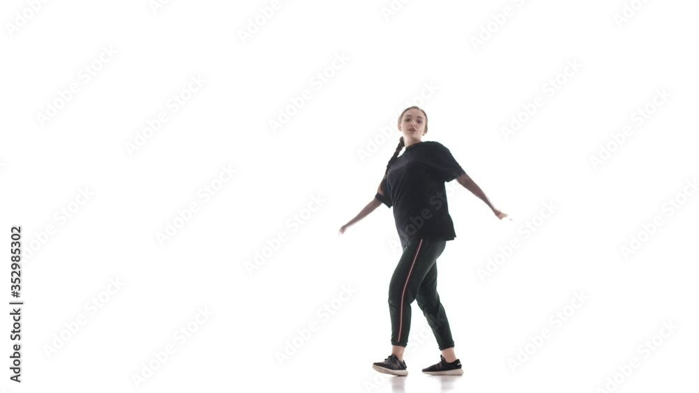young beautiful woman dancer in black leggings and a black t-shirt dancing hip hop, contemporary, modern street dance, isolated young beautiful woman dancer in black leggings and a black t-shirt dancing hip hop, contemporary, modern street dance, isolated