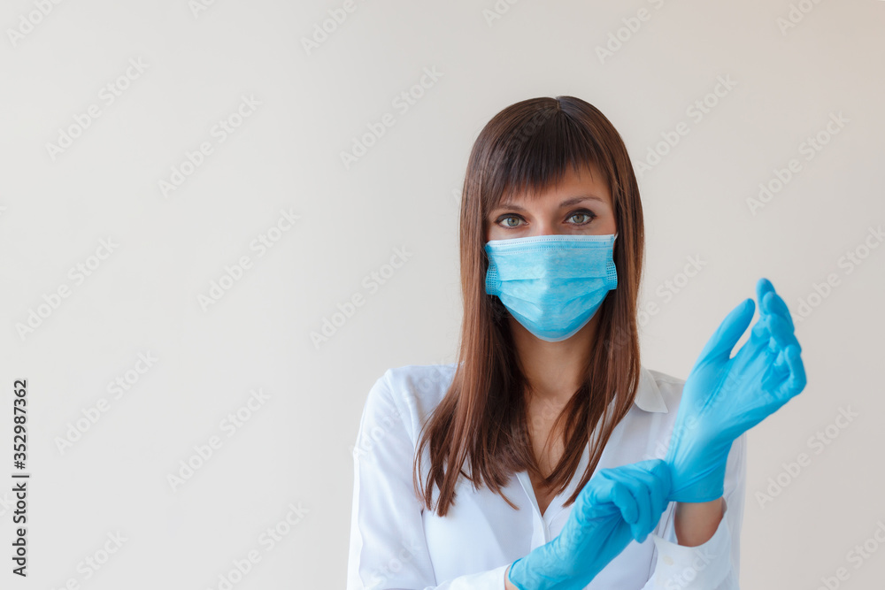 Caucasian young woman wearing protective respiratory mask and using protective gloves for prevent infection. Medical concept protection from outbreak Covid 19 virus, cold, flu, respiratory disease. Caucasian young woman wearing protective respiratory mask and using protective gloves for prevent infection. Medical concept protection from outbreak Covid 19 virus, cold, flu, respiratory disease.