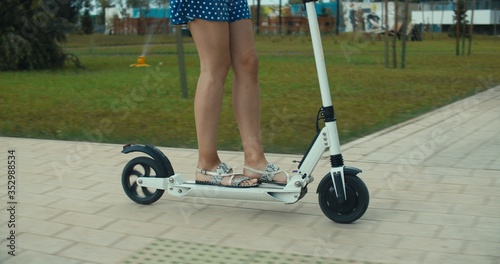 woman riding on electric kick scooter