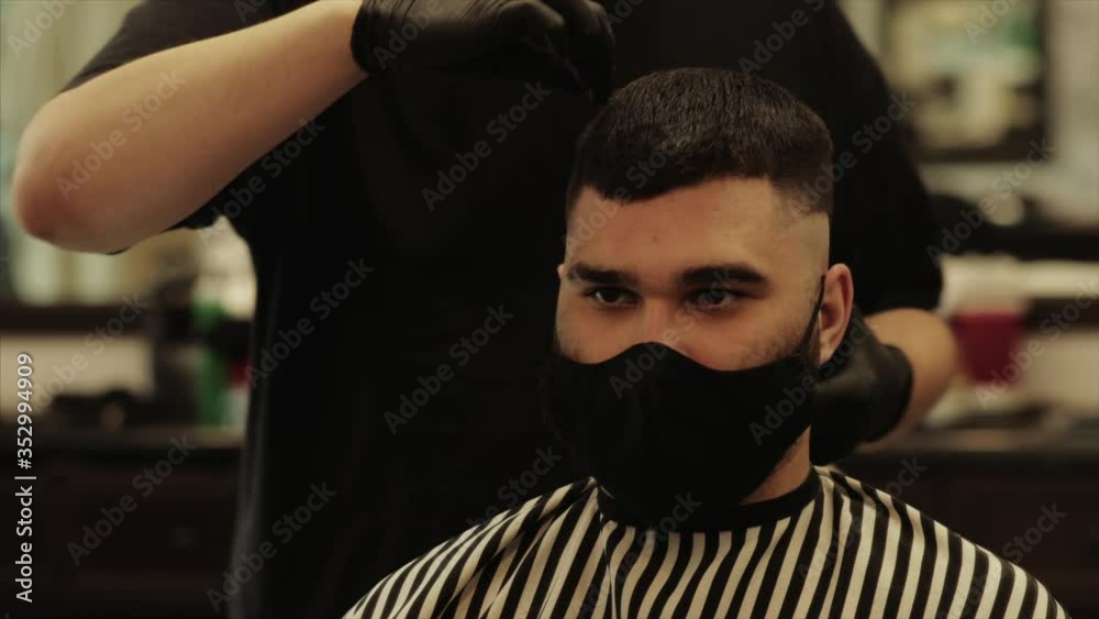Men's haircut and hair styling in a barbershop, beauty salon. Men's haircut and hair styling in a barbershop, beauty salon.