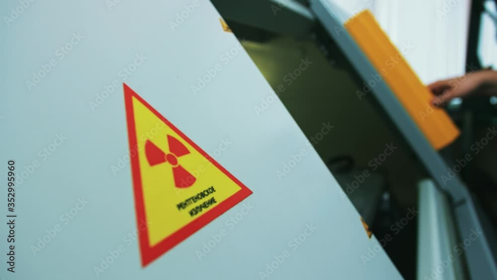 Chip Inspection Stockvideon Laboratory assistant places the chip in an X-ray scanner to ...