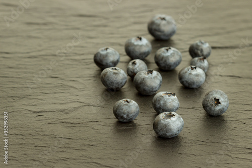 Fresh blueberries isolated on a black background.