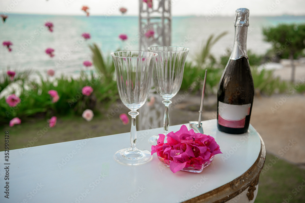 White table for a wedding ceremony with decorations on the seashore. White table for a wedding ceremony with decorations on the seashore.