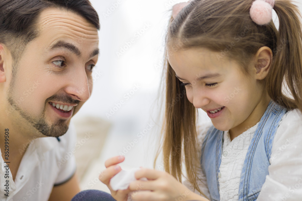 Father and daughter spending time together, talking and having fun. Father and daughter spending time together, talking and having fun.