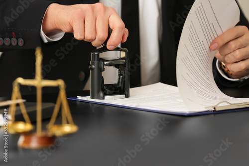 Male lawyer working with do...