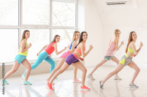 Beautiful young women dancing in studio