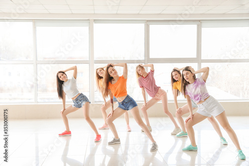 Beautiful young women dancing in studio