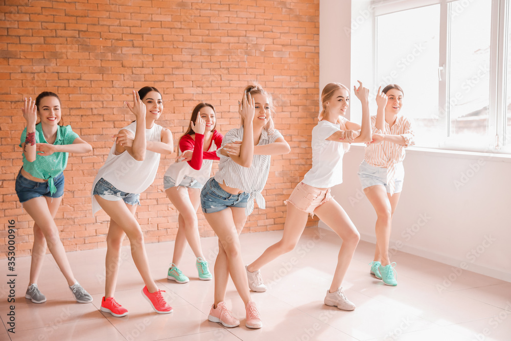 Fototapeta premium Beautiful young women dancing in studio